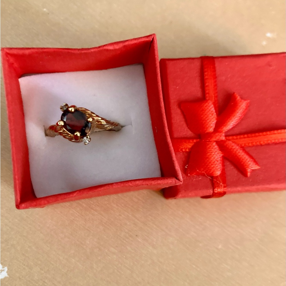 Topaz ring with tiny diamond baguette in setting